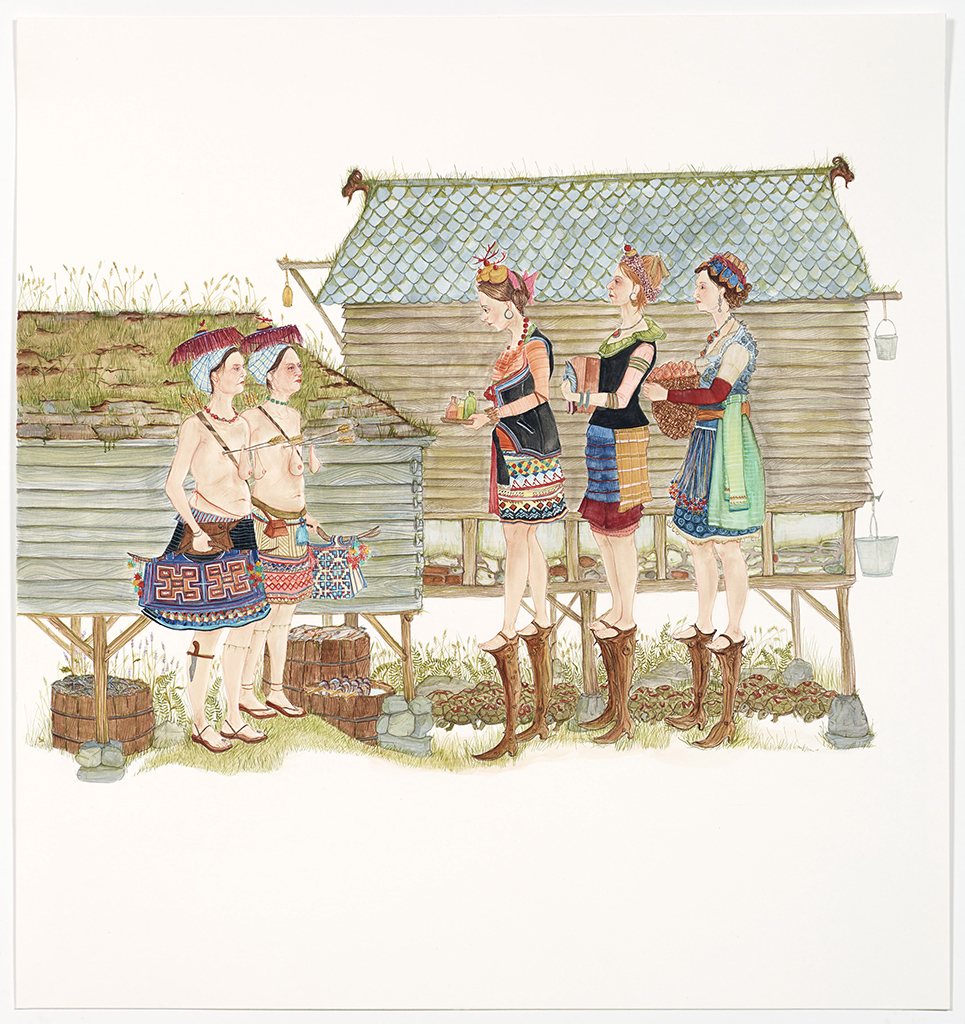 Two women talking to a group of three women on stilts
