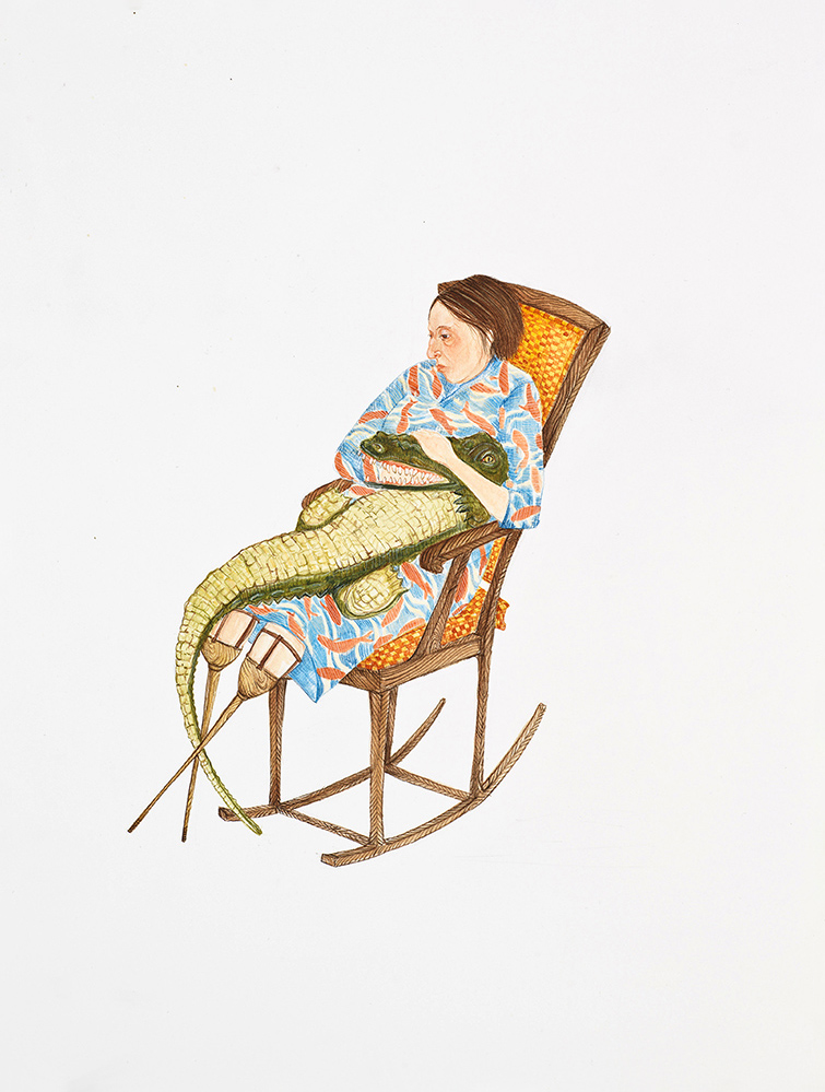 Woman in a rocking chair holding a crocodile