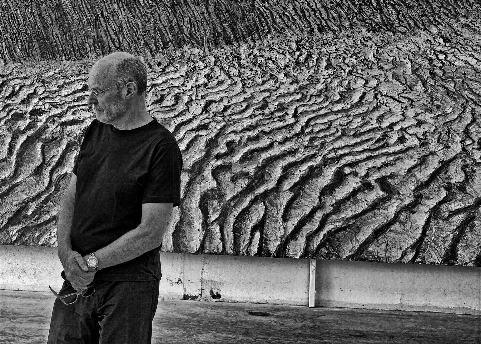 the artist in front of one of his paintings