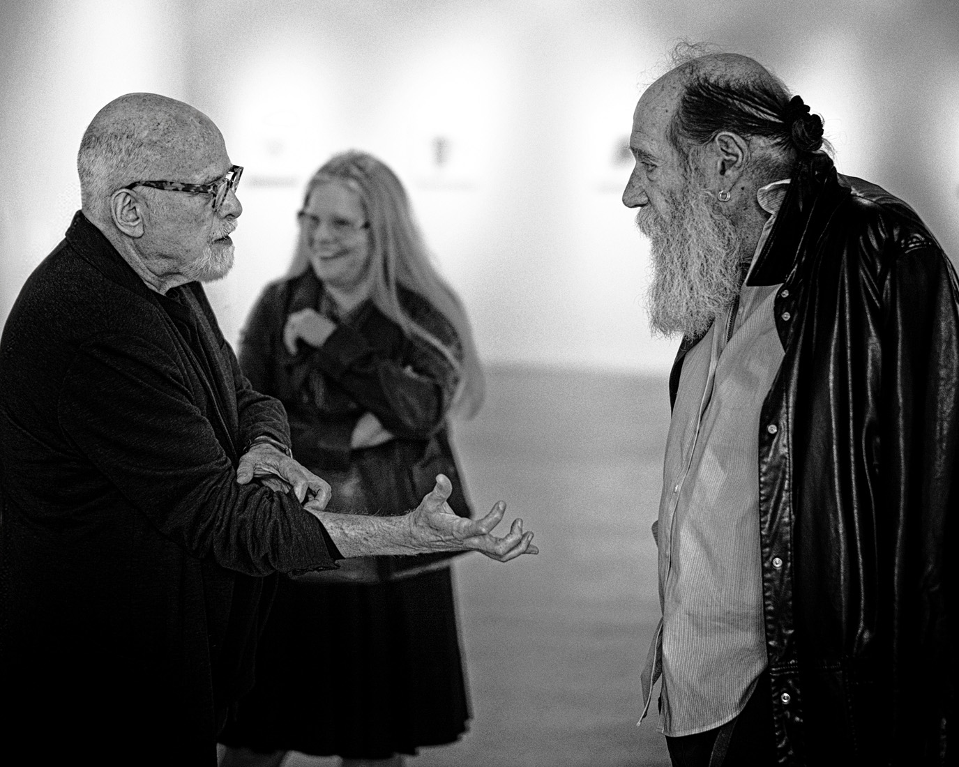 the artist looking at a painting in the museum